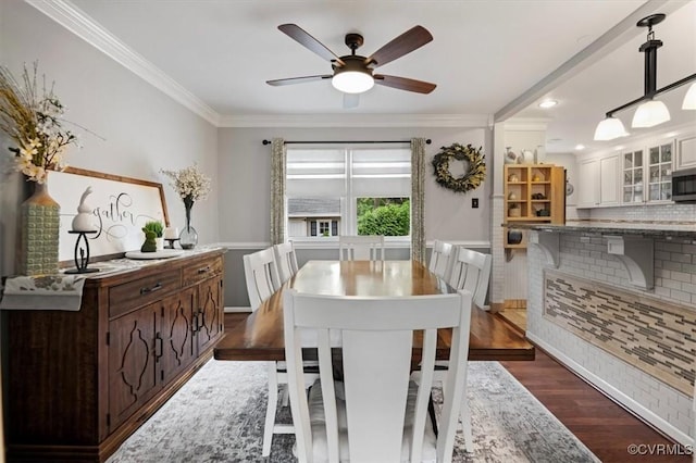 1146 Wicker Dr, Colonial Heights, VA 23834 - dining space with crown molding, dark wood-style floors, a ceiling fan, and wainscoting