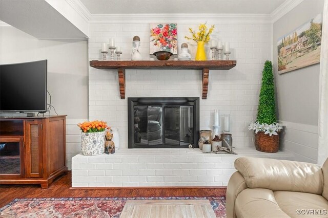 1146 Wicker Dr, Colonial Heights, VA 23834 - living area with ornamental molding, dark wood-style floors, and a fireplace
