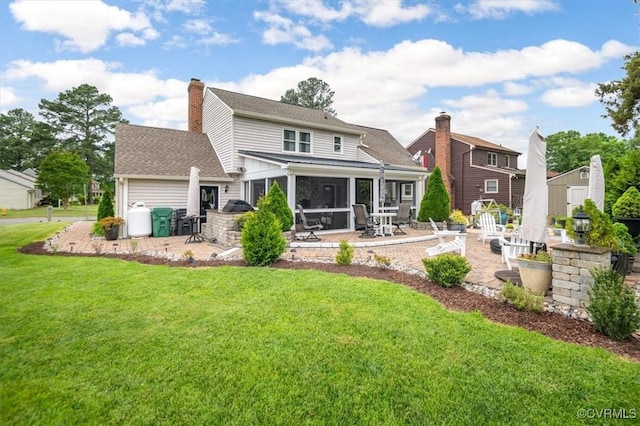1146 Wicker Dr, Colonial Heights, VA 23834 - rear view of property featuring a patio, a lawn, a sunroom, a shingled roof, and a chimney
