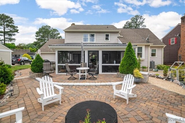 1146 Wicker Dr, Colonial Heights, VA 23834 - back of property with a sunroom and a patio