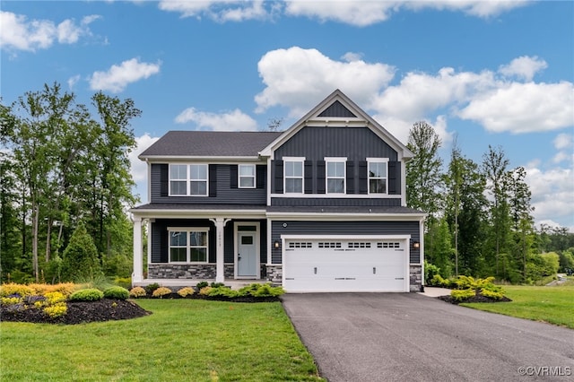14413 Botsford Ave, Chester, VA 23831 - craftsman house with a garage, asphalt driveway, board and batten siding, and a front lawn