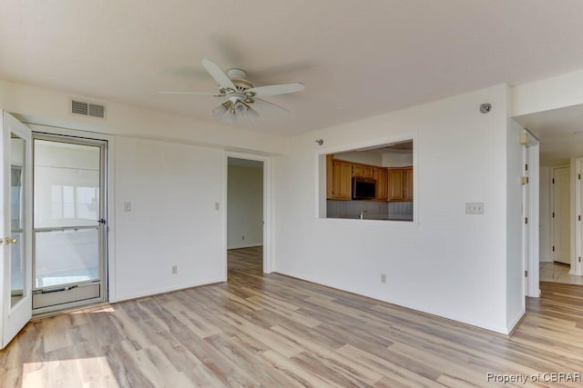 7505 River Rd Unit 4D, Newport News, VA 23607 - unfurnished living room featuring light wood-style floors, a ceiling fan, and baseboards
