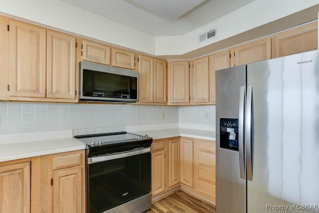 7505 River Rd Unit 4D, Newport News, VA 23607 - kitchen featuring appliances with stainless steel finishes, light brown cabinets, and light countertops