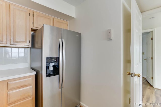 7505 River Rd Unit 4D, Newport News, VA 23607 - kitchen with stainless steel fridge with ice dispenser, light brown cabinets, tasteful backsplash, light wood finished floors, and light countertops