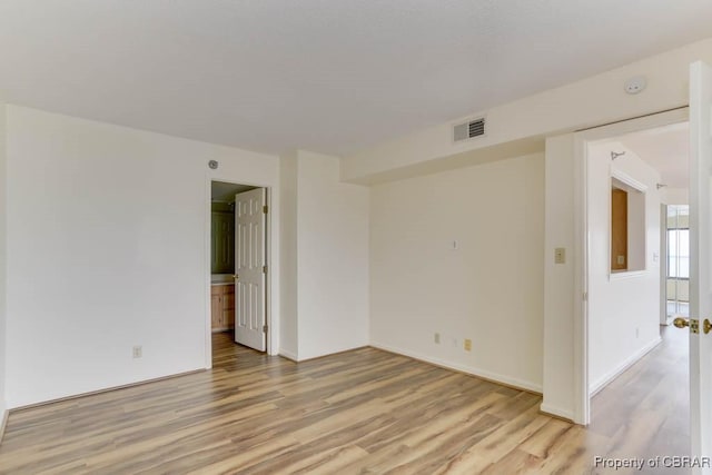 7505 River Rd Unit 4D, Newport News, VA 23607 - empty room featuring light wood finished floors and baseboards