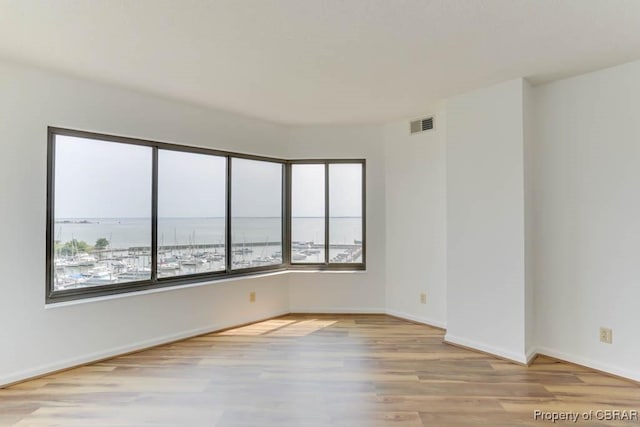 7505 River Rd Unit 4D, Newport News, VA 23607 - unfurnished room with wood finished floors and baseboards