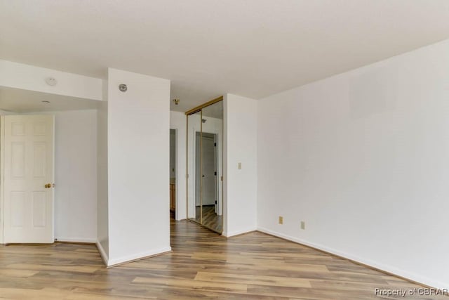 7505 River Rd Unit 4D, Newport News, VA 23607 - empty room with light wood finished floors and baseboards