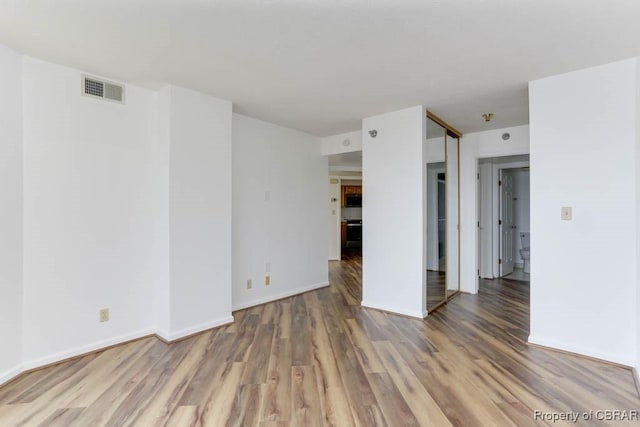 7505 River Rd Unit 4D, Newport News, VA 23607 - empty room with light wood finished floors and baseboards