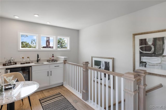 5429 Gillies Creek Mews, Henrico, VA 23231 - indoor wet bar with light wood-type flooring and dishwashing machine