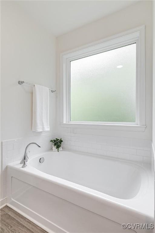 8412 Morocco Pl, Moseley, VA 23832 - bathroom with a bath and wood finished floors