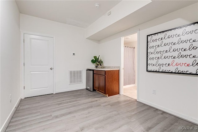 8412 Morocco Pl, Moseley, VA 23832 - spare room featuring light wood-style flooring and a smoke detector