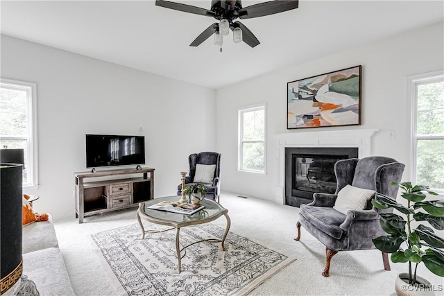 8412 Morocco Pl, Moseley, VA 23832 - living area featuring carpet flooring, a ceiling fan, and a glass covered fireplace