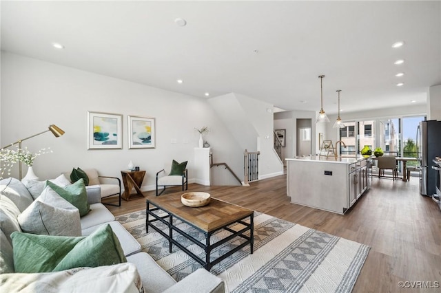5427 Gillies Creek Mews, Henrico, VA 23231 - living room with wood finished floors, recessed lighting, and baseboards