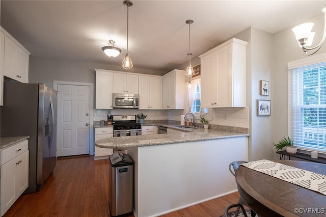 9604 Weston Ln, Henrico, VA 23238 - kitchen featuring stainless steel appliances, a peninsula, a sink, tasteful backsplash, and white cabinets