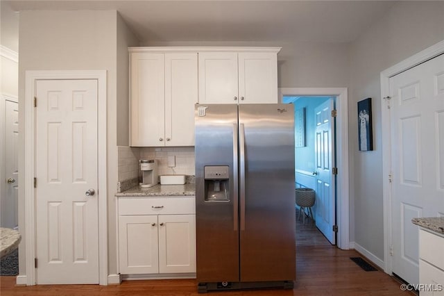 9604 Weston Ln, Henrico, VA 23238 - kitchen with stainless steel fridge with ice dispenser, white cabinetry, and light stone countertops