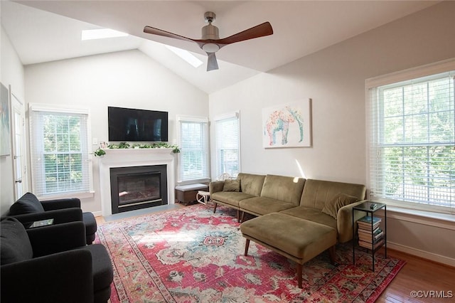 9604 Weston Ln, Henrico, VA 23238 - living room with healthy amount of natural light, ceiling fan, wood finished floors, lofted ceiling, and a glass covered fireplace