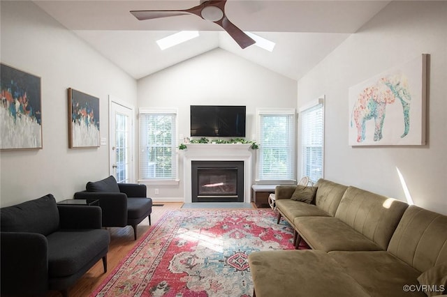 9604 Weston Ln, Henrico, VA 23238 - living area featuring a skylight, a ceiling fan, wood finished floors, a fireplace with flush hearth, and vaulted ceiling