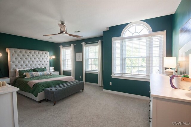 9604 Weston Ln, Henrico, VA 23238 - carpeted bedroom with multiple windows, baseboards, and a ceiling fan