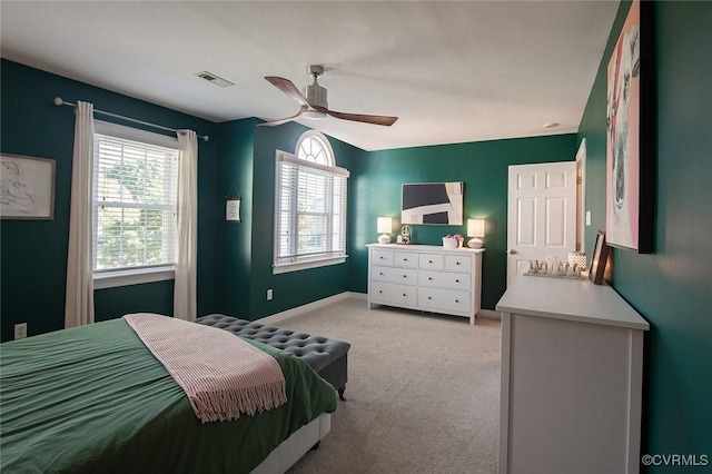 9604 Weston Ln, Henrico, VA 23238 - bedroom with multiple windows, light colored carpet, baseboards, and a ceiling fan