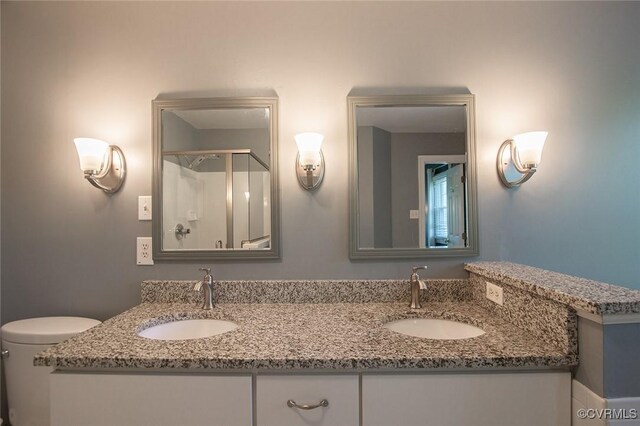 9604 Weston Ln, Henrico, VA 23238 - full bath featuring a stall shower, double vanity, and toilet