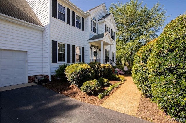 9604 Weston Ln, Henrico, VA 23238 - view of front facade with a garage and roof with shingles