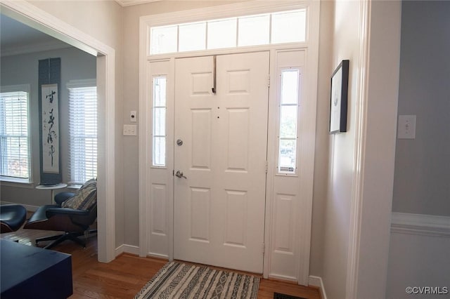 9604 Weston Ln, Henrico, VA 23238 - foyer entrance with wood finished floors, ornamental molding, and baseboards