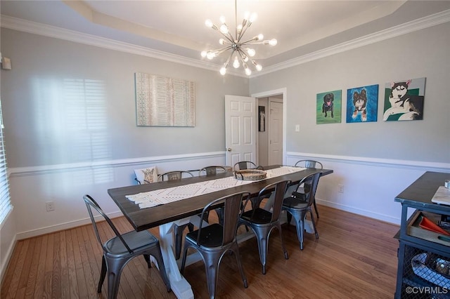 9604 Weston Ln, Henrico, VA 23238 - dining area with a chandelier, wood finished floors, a tray ceiling, ornamental molding, and baseboards