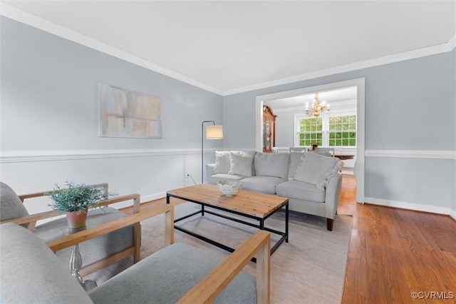 9140 Robin Ridge Dr, Hanover, VA 23116 - living area with a chandelier, crown molding, wood finished floors, and baseboards