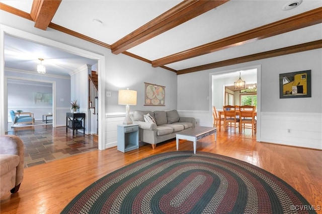 9140 Robin Ridge Dr, Hanover, VA 23116 - living area with a wainscoted wall, wood finished floors, beam ceiling, and ornamental molding
