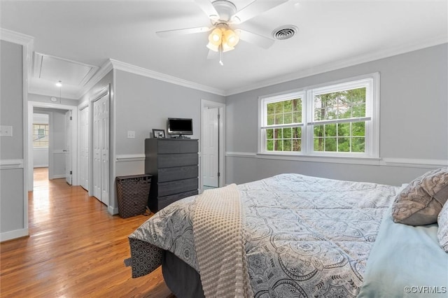 9140 Robin Ridge Dr, Hanover, VA 23116 - bedroom with attic access, crown molding, multiple windows, wood finished floors, and a ceiling fan