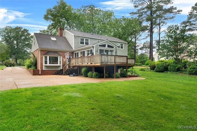9140 Robin Ridge Dr, Hanover, VA 23116 - back of house featuring brick siding, a wooden deck, a yard, a chimney, and a patio