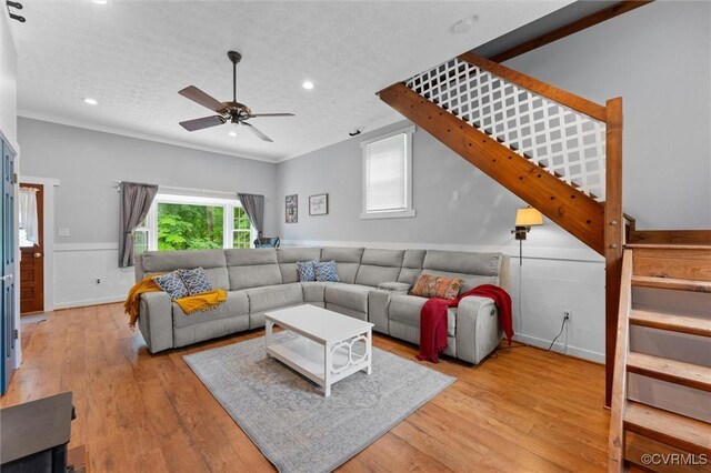 9140 Robin Ridge Dr, Hanover, VA 23116 - living room with stairs, recessed lighting, wainscoting, ceiling fan, and wood finished floors