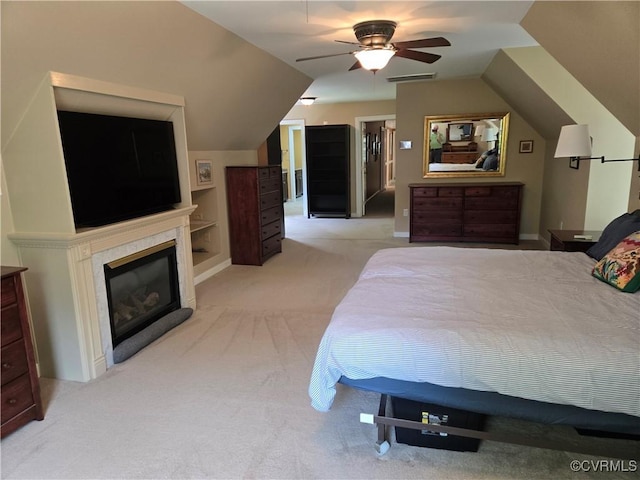 9701 Waterfowl Flyway, Chesterfield, VA 23838 - bedroom featuring light colored carpet, a fireplace, vaulted ceiling, ceiling fan, and baseboards