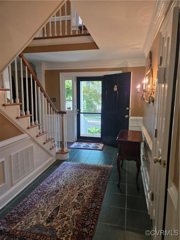 9701 Waterfowl Flyway, Chesterfield, VA 23838 - entryway with tile patterned floors, stairs, a chandelier, and ornamental molding