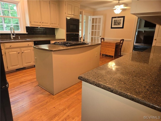9701 Waterfowl Flyway, Chesterfield, VA 23838 - kitchen with a sink, crown molding, gas stovetop, light wood finished floors, and ceiling fan