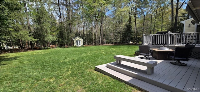 9701 Waterfowl Flyway, Chesterfield, VA 23838 - view of grassy yard with a deck, a fire pit, and an outdoor structure
