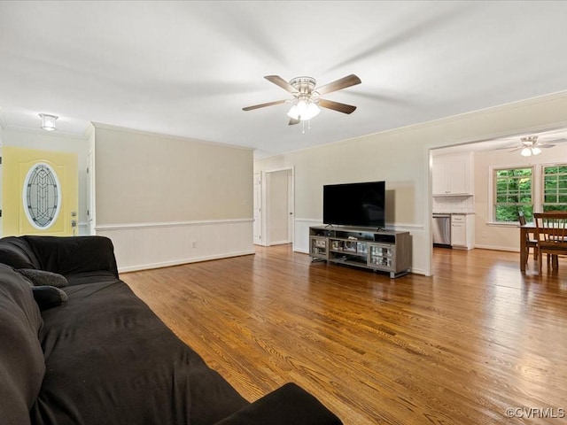 13610 Old Stage Rd, North Prince George, VA 23860 - living room with a ceiling fan, wood finished floors, a wainscoted wall, and ornamental molding