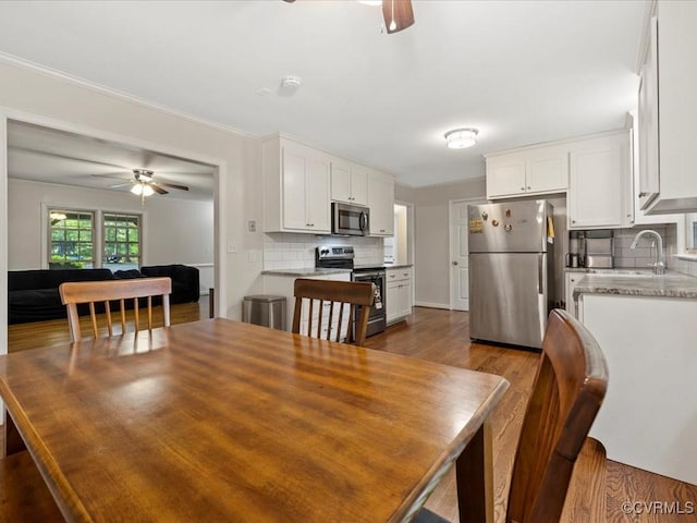 13610 Old Stage Rd, North Prince George, VA 23860 - dining area with ceiling fan and dark wood-style flooring