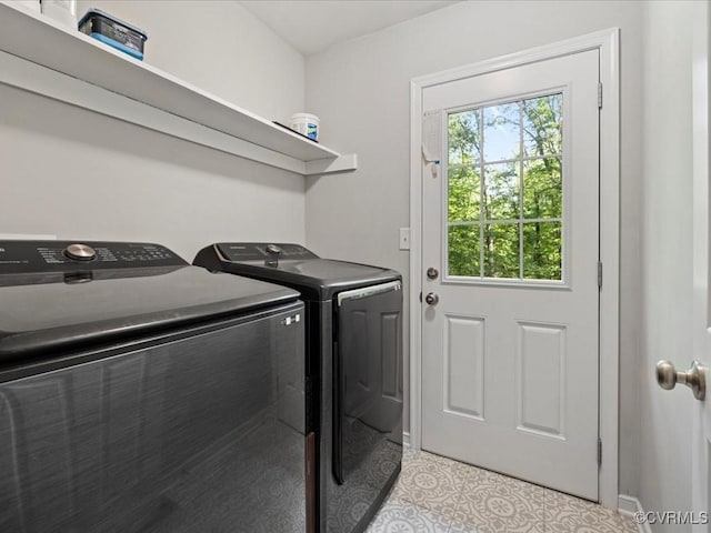 13610 Old Stage Rd, North Prince George, VA 23860 - laundry area featuring separate washer and dryer, light tile patterned flooring, and baseboards