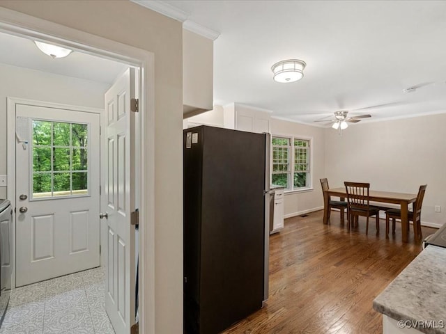 13610 Old Stage Rd, North Prince George, VA 23860 - kitchen featuring freestanding refrigerator, a ceiling fan, white cabinets, light countertops, and crown molding
