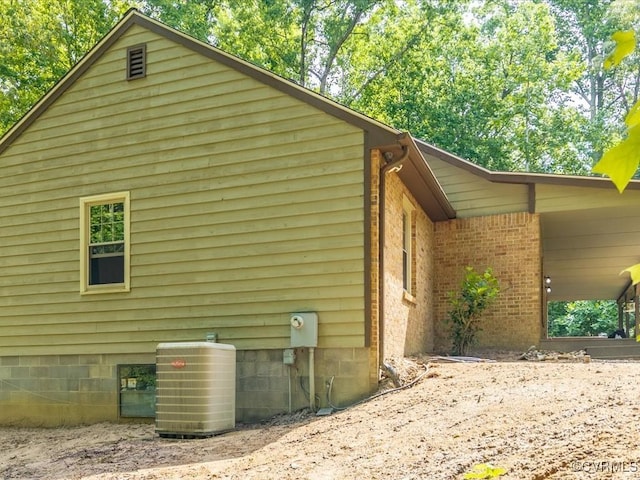 13610 Old Stage Rd, North Prince George, VA 23860 - view of home's exterior featuring cooling unit and brick siding