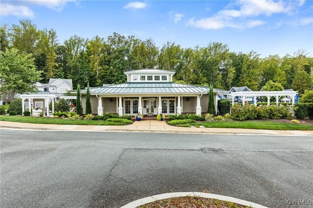 9477 Creek Summit Cir, Richmond, VA 23235 - view of front of house with french doors, a standing seam roof, metal roof, and a pergola