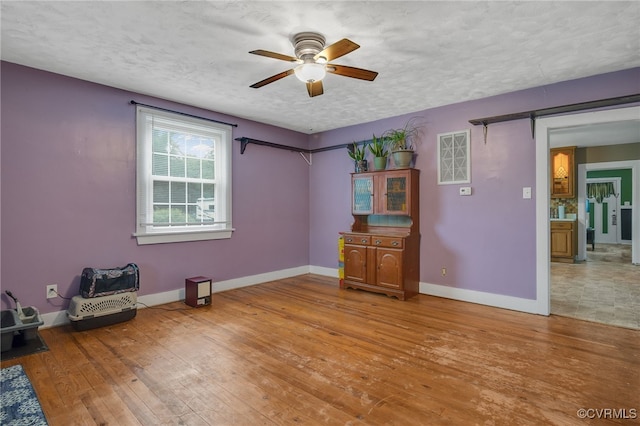 100 N Battery St, Henrico, VA 23075 - spare room featuring a ceiling fan, baseboards, and hardwood / wood-style flooring