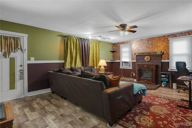 100 N Battery St, Henrico, VA 23075 - living room featuring a wainscoted wall, a ceiling fan, a brick fireplace, and wood finished floors
