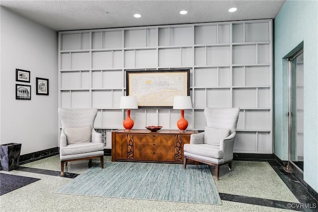 1350 Westwood Ave Unit 406, Richmond, VA 23227 - sitting room featuring a textured ceiling, baseboards, and recessed lighting