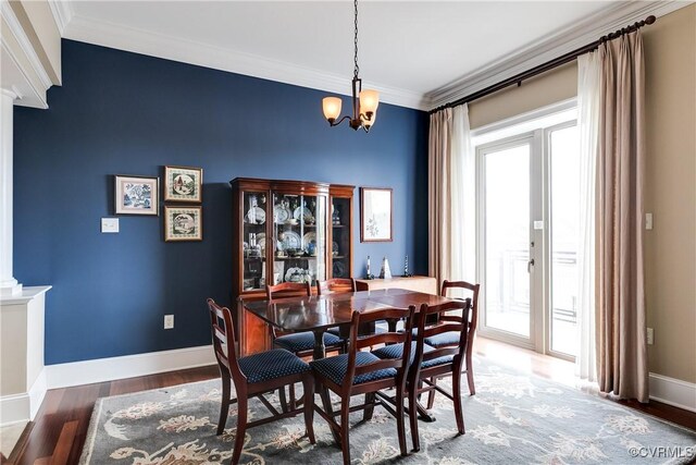 1350 Westwood Ave Unit 406, Richmond, VA 23227 - dining space featuring a chandelier, baseboards, crown molding, wood finished floors, and decorative columns
