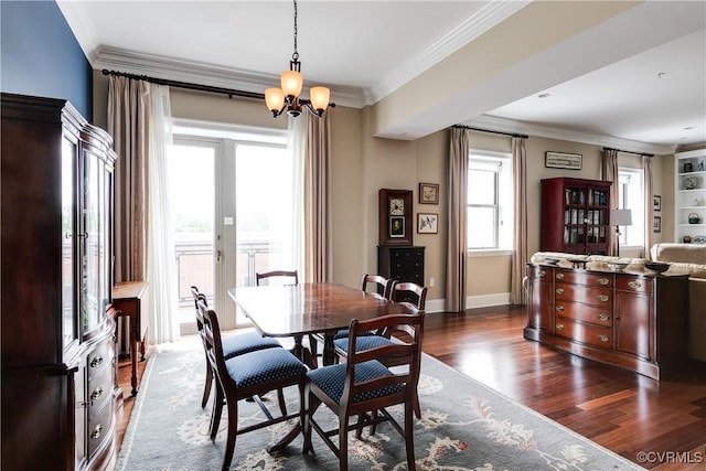 1350 Westwood Ave Unit 406, Richmond, VA 23227 - dining area with dark wood-style floors, ornamental molding, a chandelier, and baseboards
