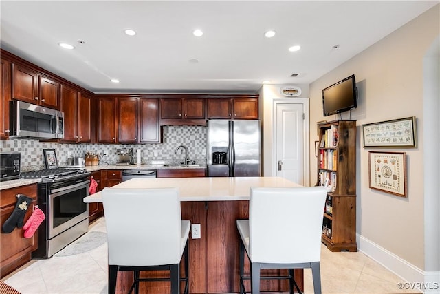 1350 Westwood Ave Unit 406, Richmond, VA 23227 - kitchen with appliances with stainless steel finishes, a sink, backsplash, light countertops, and recessed lighting