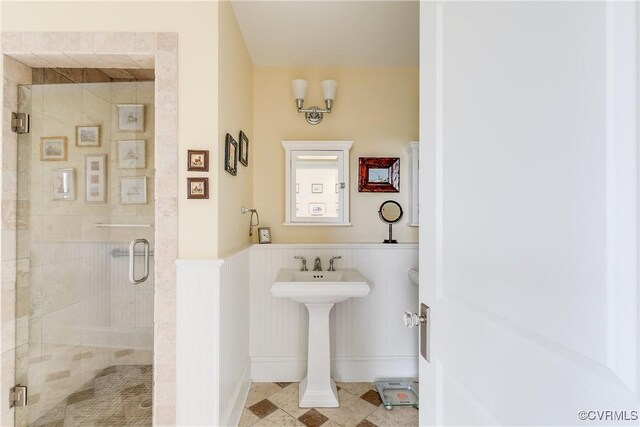 1350 Westwood Ave Unit 406, Richmond, VA 23227 - bathroom with a stall shower, a wainscoted wall, and a sink