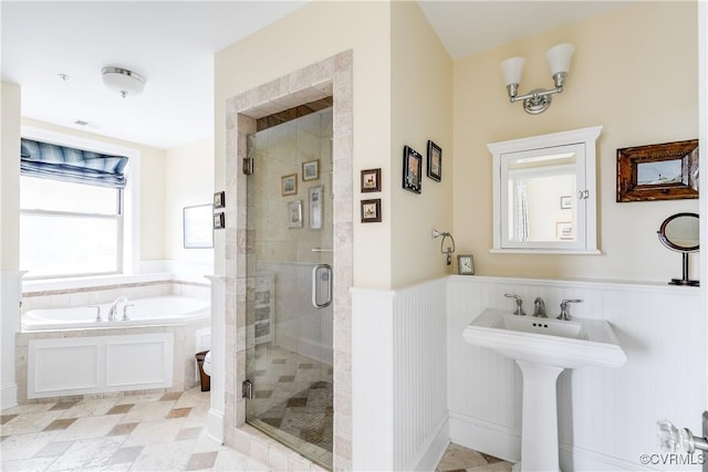 1350 Westwood Ave Unit 406, Richmond, VA 23227 - full bathroom featuring a stall shower, a bath, wainscoting, a sink, and toilet